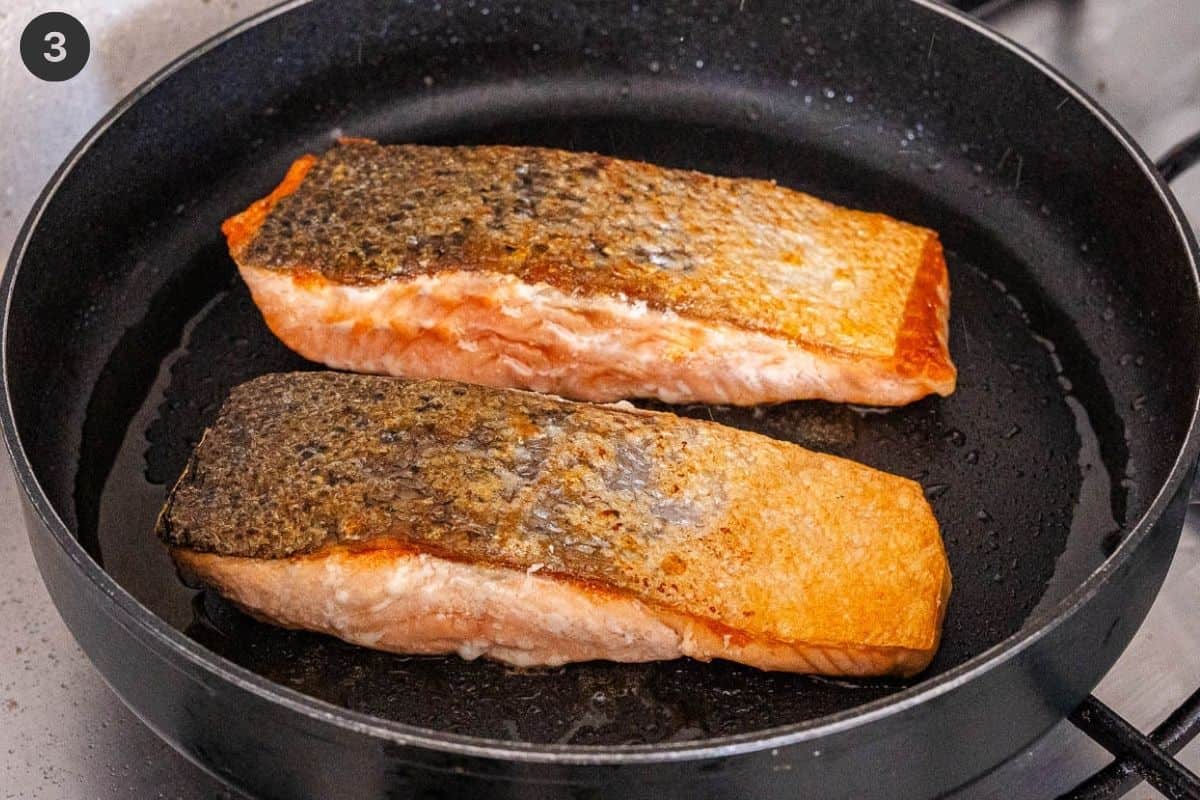 Salmon fillets flipped to cook the other side