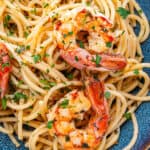 Shrimp pasta served in a bowl with parsley and chili flakes