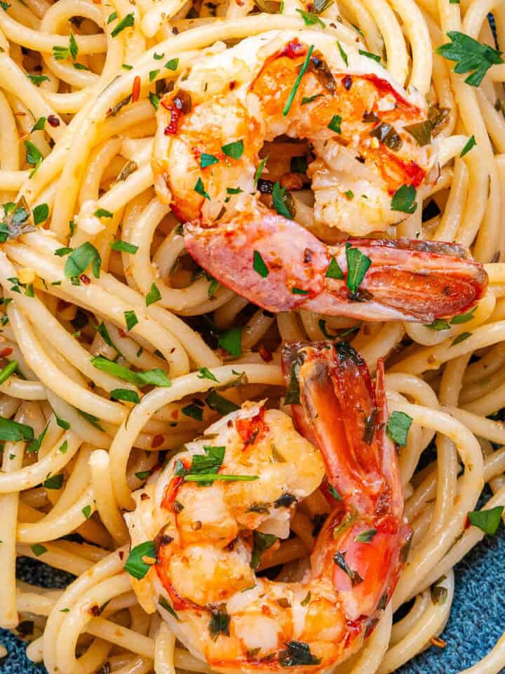 Shrimp pasta served in a bowl with parsley and chili flakes