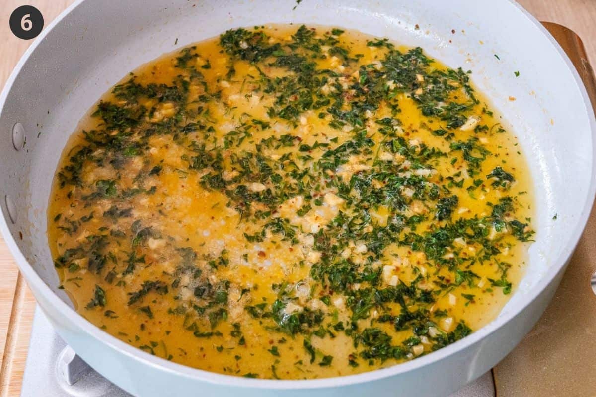 Lemon juice and pasta water added to the pan