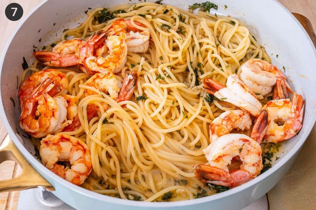 Cooked pasta and shrimp added to the pan