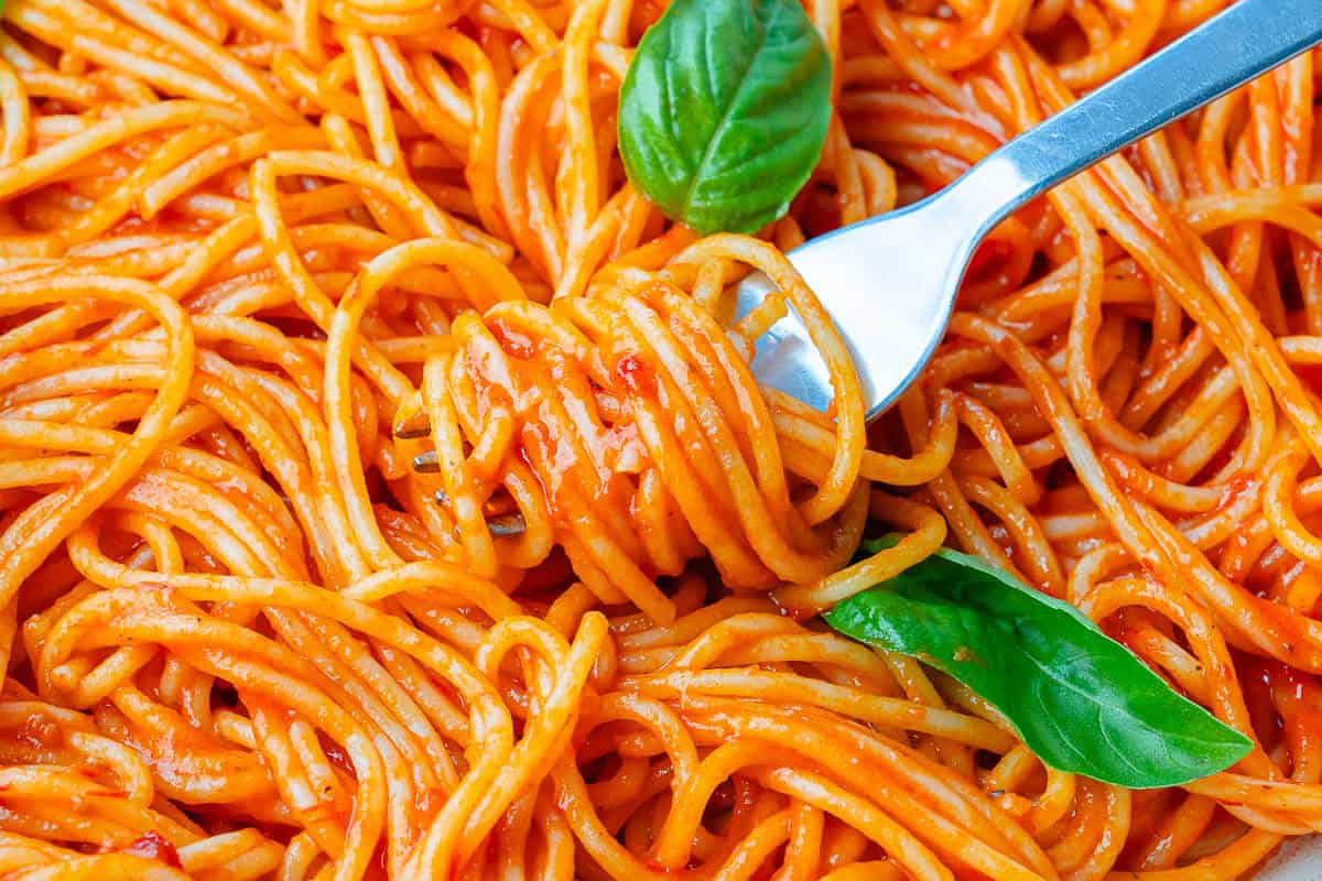 Pasta pomodoro twirled in fork of pasta