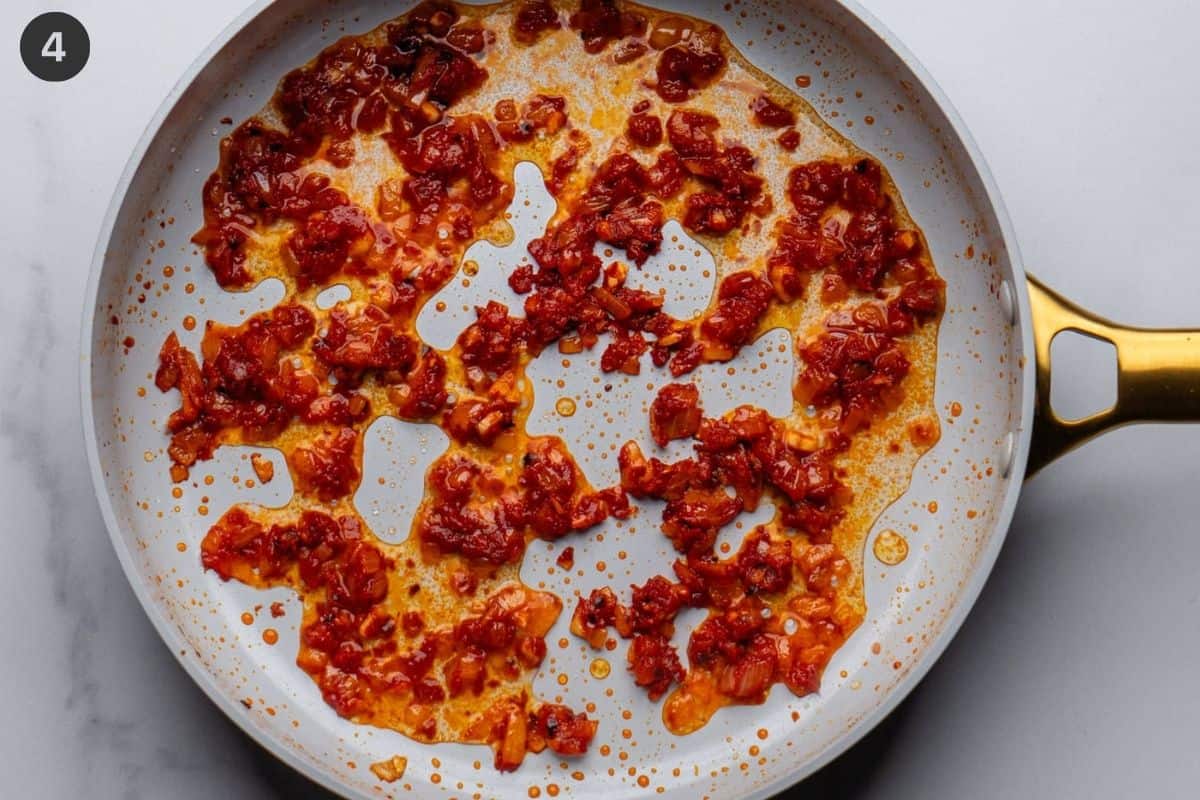 Vodka added to tomato base sauce and cooked down