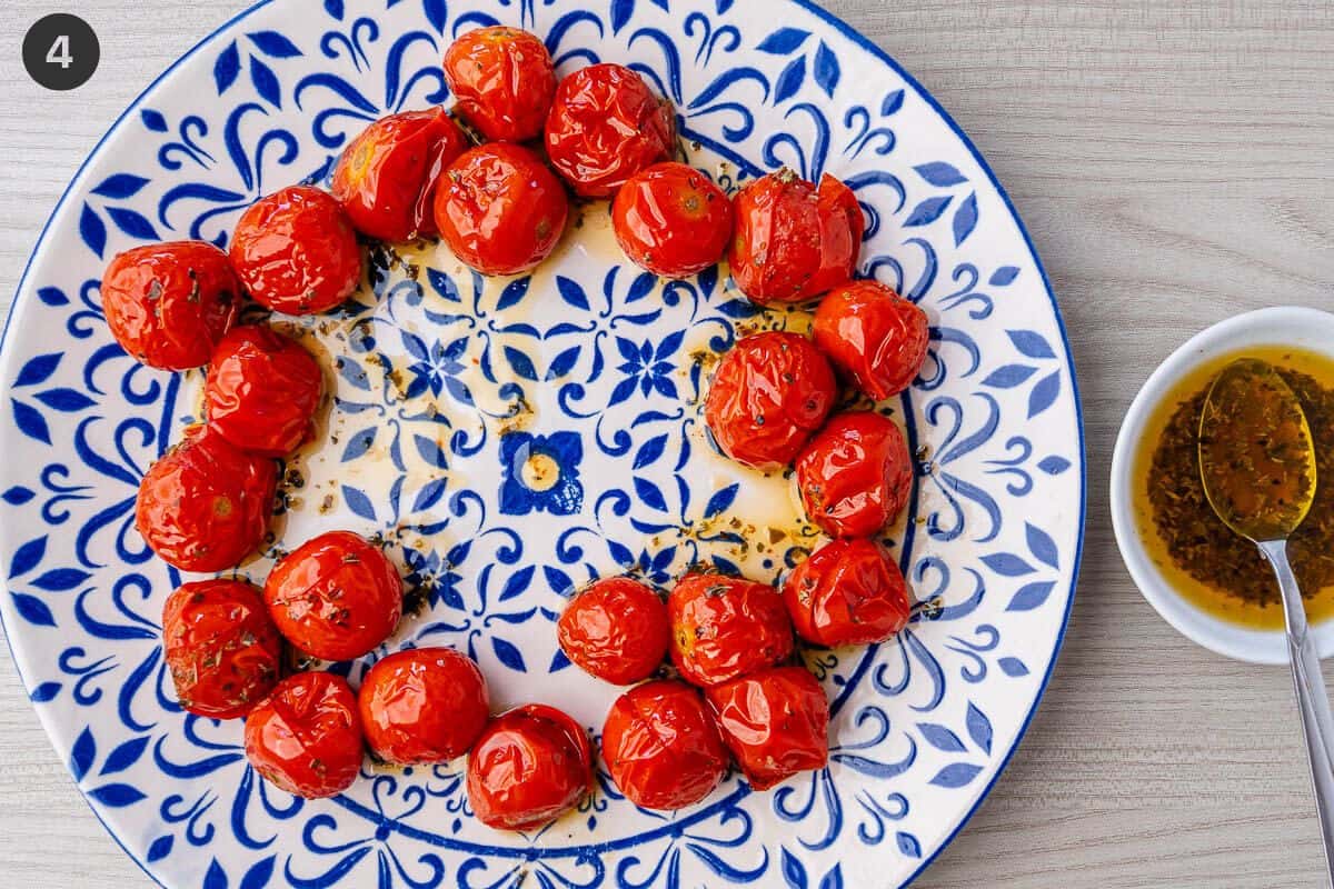 Roasted tomatoes arranged in a circle on a plate