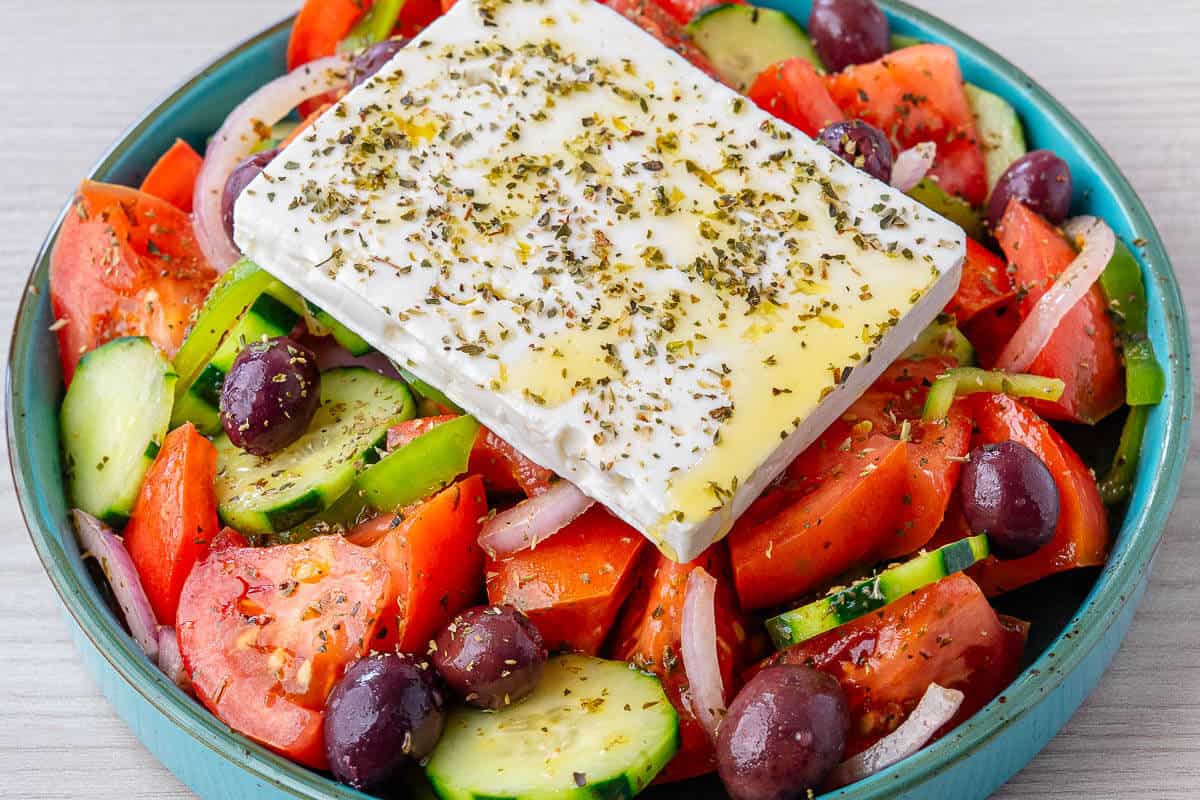 Greek Salad with a block of feta placed on top