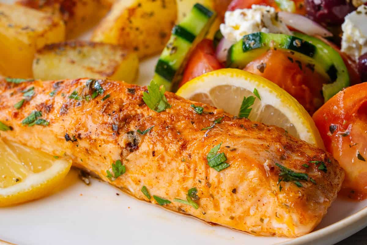Lemon Garlic Salmon served with Greek salad and roasted potatoes