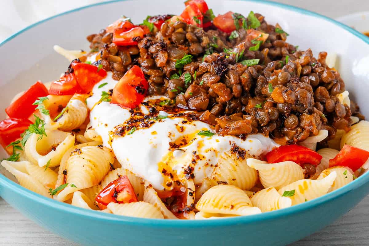 Turkish Pasta in a bowl drizzled with aleppo pepper