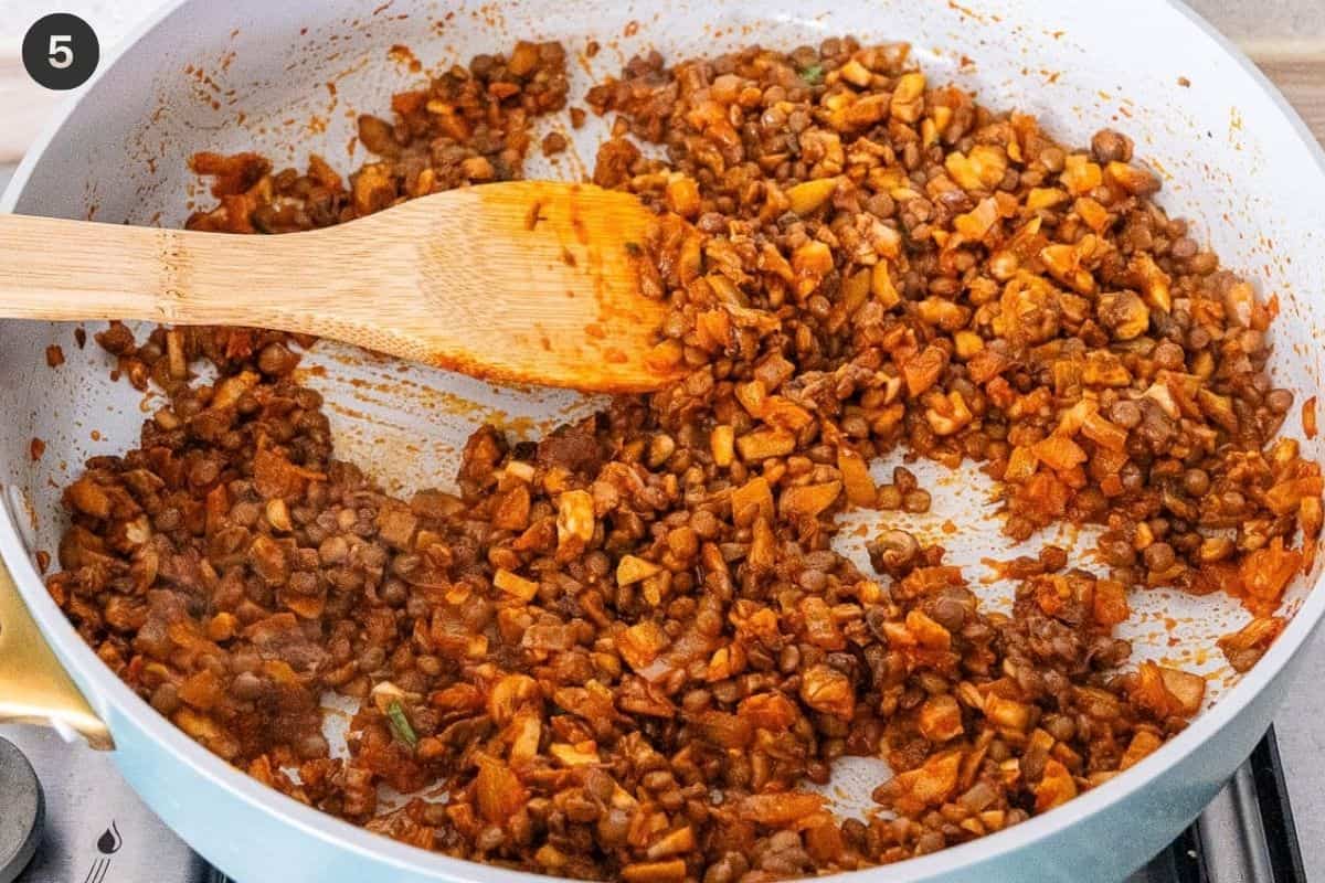 Lentils added in the pan to finish of the mixture