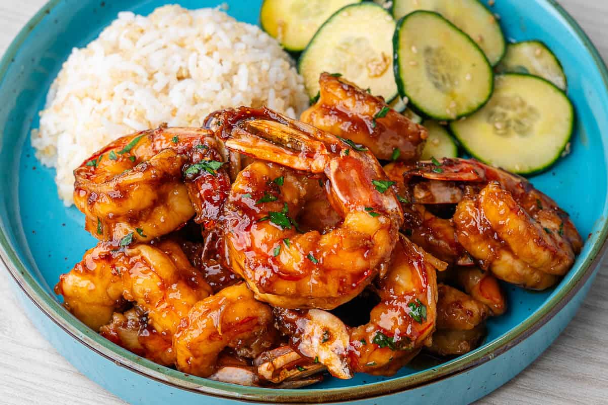 Honey garlic shrimp served with quinoa rice and cucumber salad