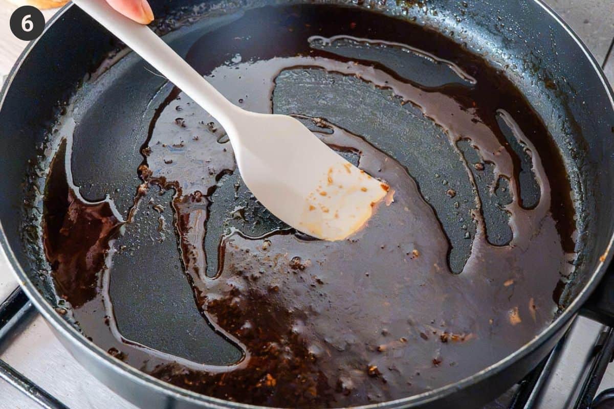Shrimp removed from pan and sauce being cooked down to make a thicker glaze