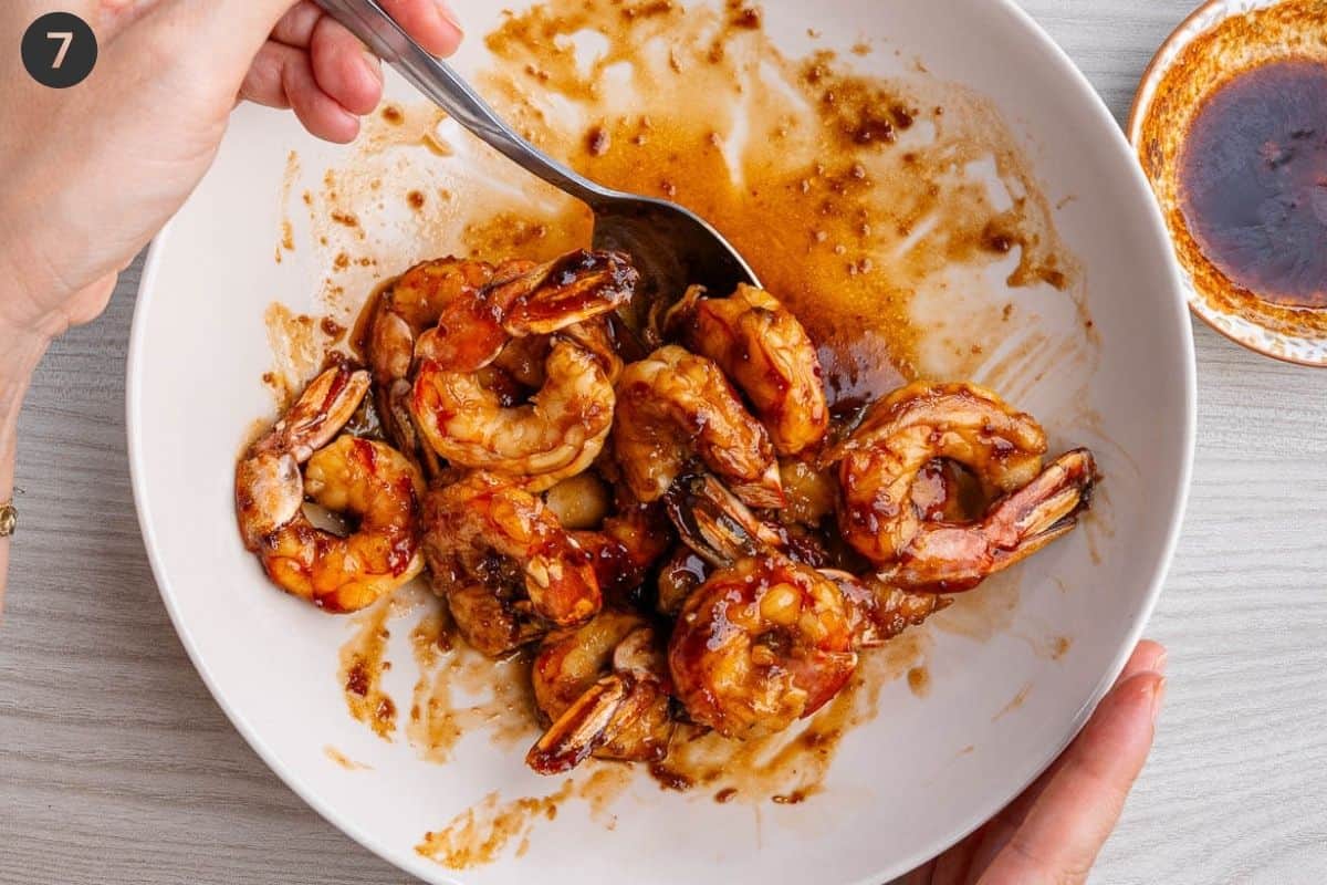 Thick glaze added to shrimp and mixed together
