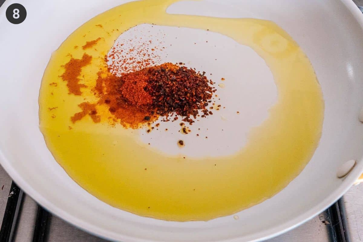 Aleppo pepper ingredients added to a pan